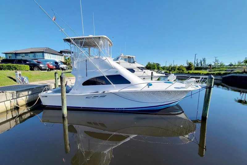 Slide: The Image of Engine compartment of a 1998 Luhrs 36 Convertible boat, showcasing mechanical components. - 59