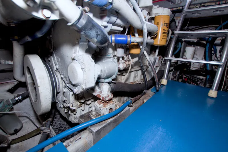 Slide: The Image of Engine room of 1998 Luhrs 36 Convertible boat with visible machinery and components. - 66