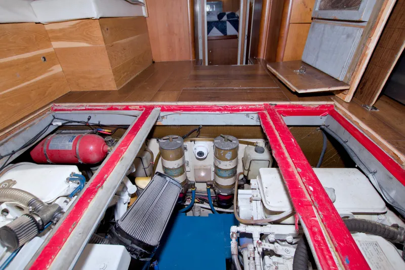 Slide: The Image of Engine room of 1998 Luhrs 36 Convertible boat with visible components and fire extinguisher. - 69