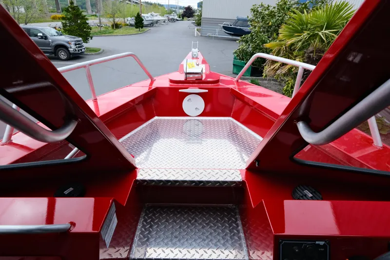 Slide: The Image of 2025 Hewescraft 250 Alaskan boat with red deck and diamond plate flooring. - 16