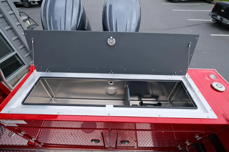 Slide: The Image of 2025 Hewescraft 250 Alaskan boat with open storage compartment and dual engines. - 22