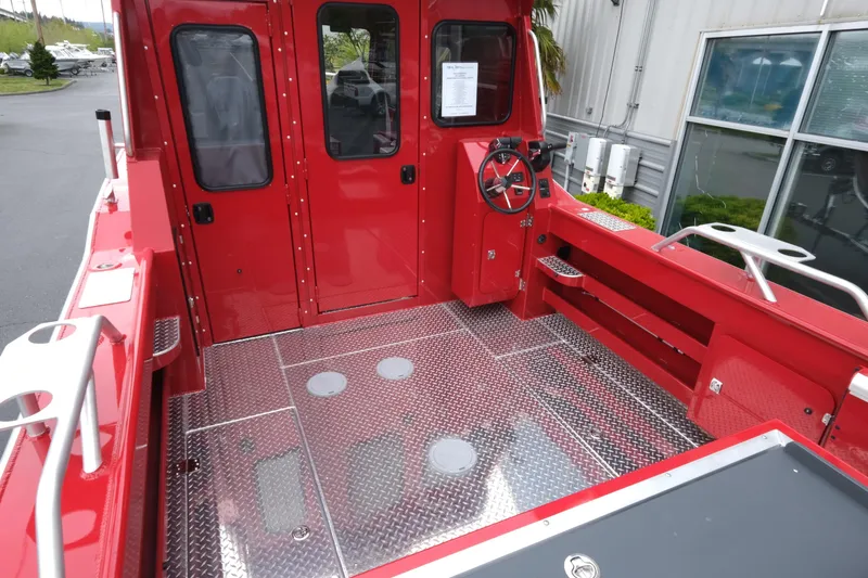 Slide: The Image of 2025 Hewescraft 250 Alaskan boat interior with red cabin and metal flooring. - 7