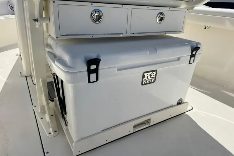 Slide: The Image of 2026 Key West 244 Center Console with K2 cooler and storage drawers. - 14