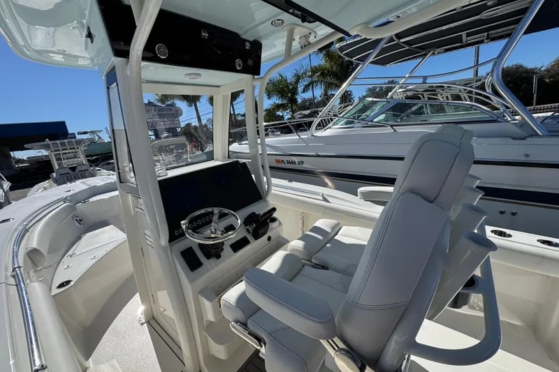 Slide: The Image of 2026 Key West 244 Center Console boat interior with modern helm and seating. - 16