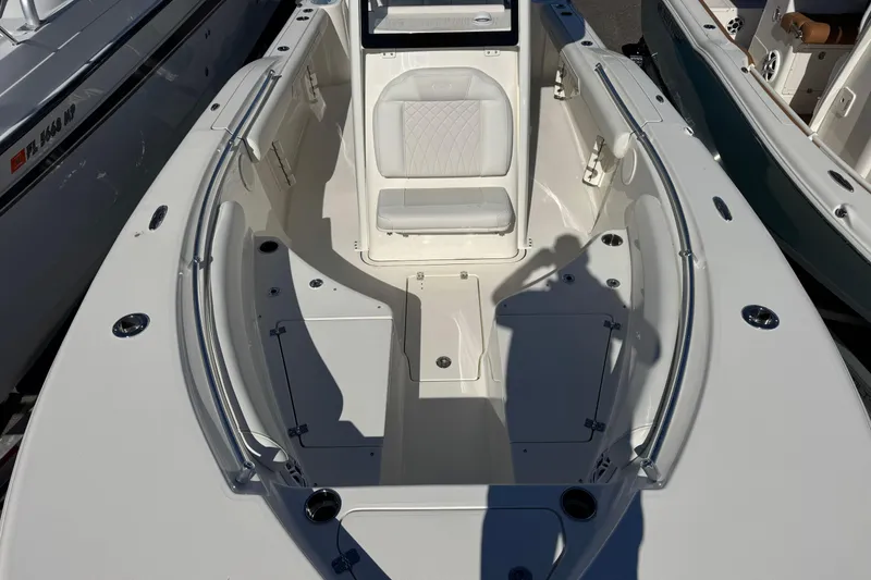 Slide: The Image of 2026 Key West 244 Center Console boat interior with seating and storage compartments. - 24