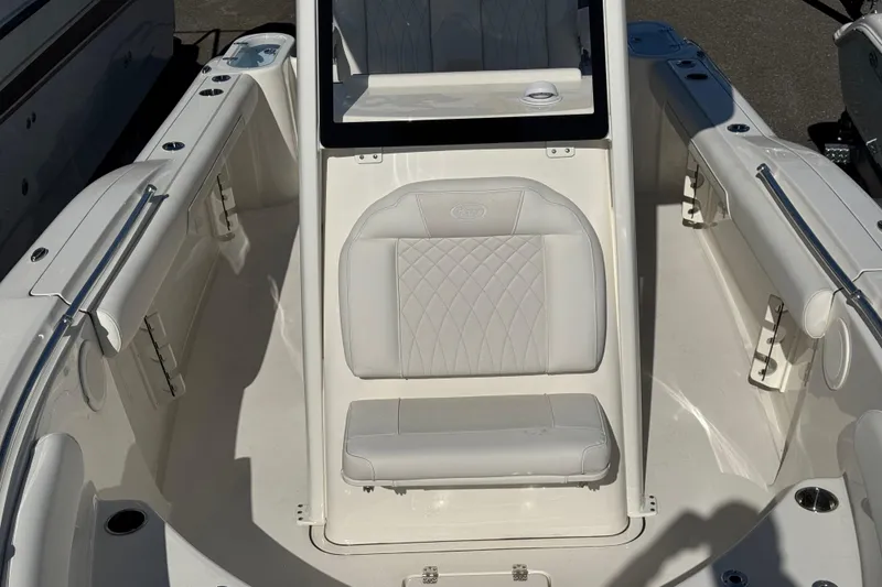 Slide: The Image of 2026 Key West 244 Center Console boat interior with white seating and sleek design. - 26
