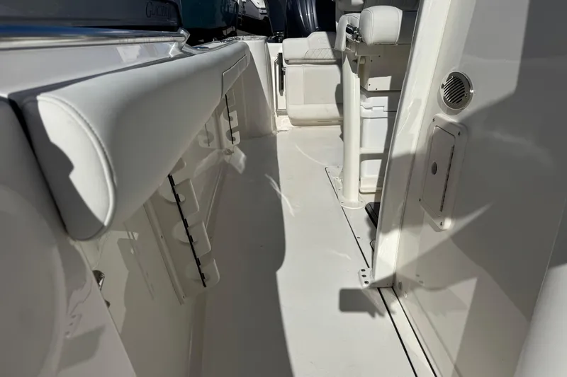Slide: The Image of 2026 Key West 244 Center Console boat interior with seating and storage compartments. - 28