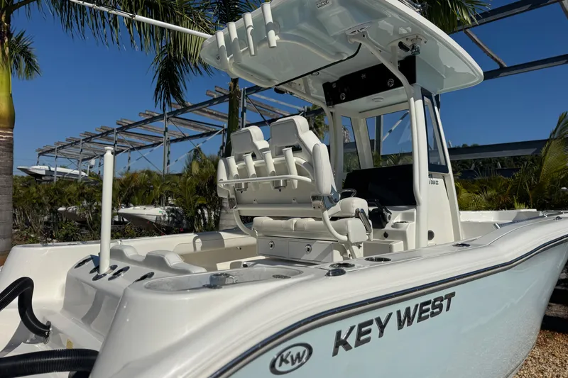 Slide: The Image of 2026 Key West 244 Center Console boat with sleek design, palm trees in background. - 8