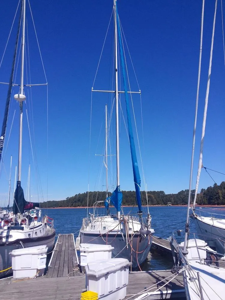Slide: The Image of Sailboats docked under blue sky, 1973 Allied Mistress. - 16