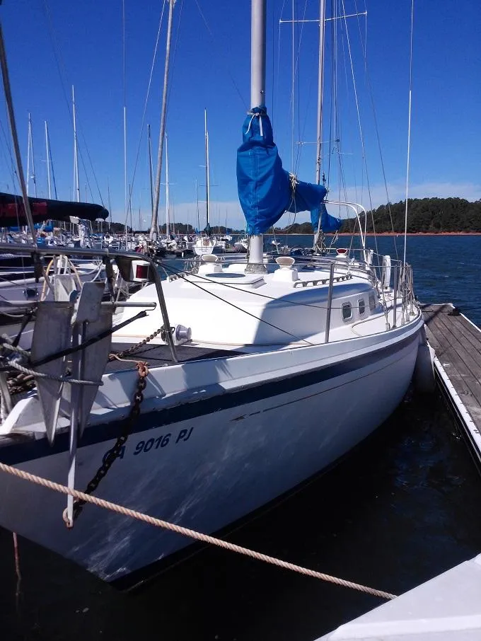 Slide: The Image of 1973 Allied Mistress sailboat docked in harbor. - 22