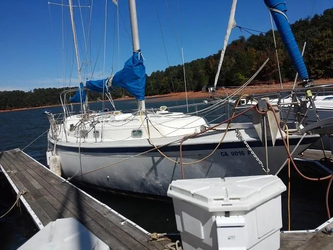 Slide: The Image of 1973 Allied Mistress sailboat docked at marina. - 24