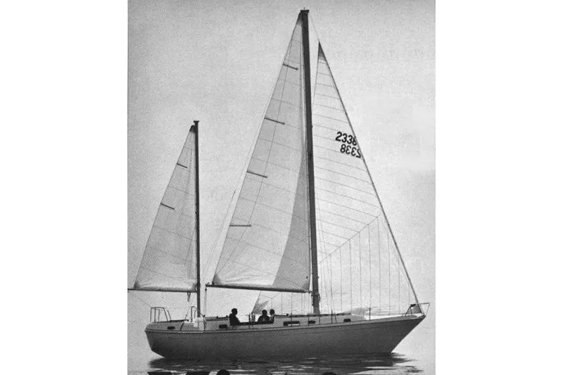 Slide: The Image of 1973 Allied Mistress sailboat with two sails on calm water. - 26