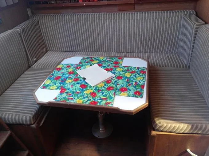 Slide: The Image of 1973 Allied Mistress interior with striped sofa and colorful table. - 3