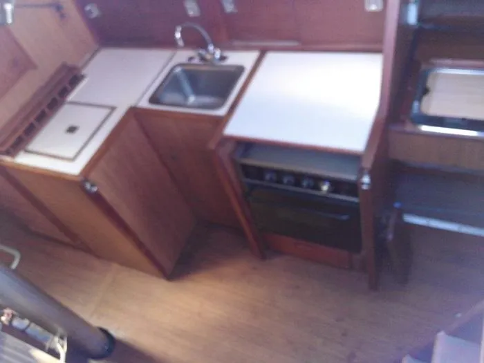 Slide: The Image of 1973 Allied Mistress yacht kitchen area with sink and stove. - 4
