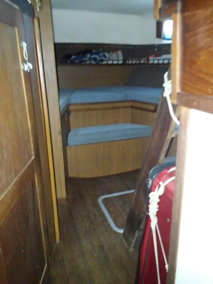 Slide: The Image of Interior of a 1973 Allied Mistress yacht with wooden furnishings. - 6