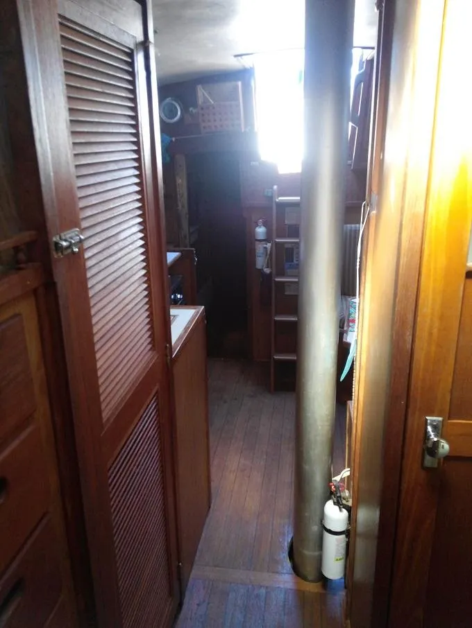 Slide: The Image of Interior of a 1973 Allied Mistress yacht with wooden furnishings. - 7