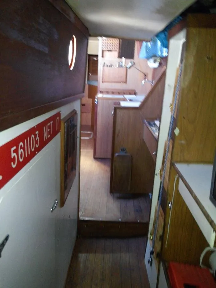 Slide: The Image of Interior of a 1973 Allied Mistress yacht with wooden furnishings. - 8