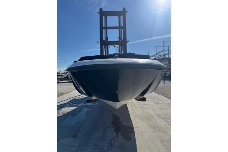 Slide: The Image of 2018 Bayliner Element E21 boat on a lift under clear blue sky. - 13