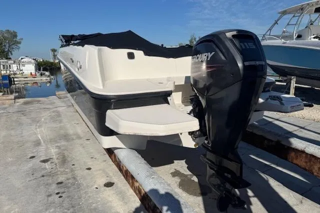 Slide: The Image of 2018 Bayliner Element E21 boat with Mercury outboard motor on a dock. - 14
