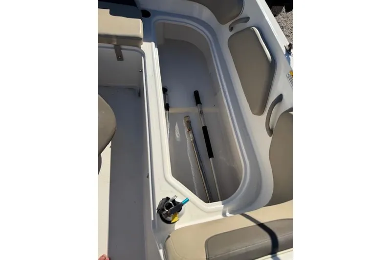 Slide: The Image of 2018 Bayliner Element E21 boat storage compartment with accessories. - 21
