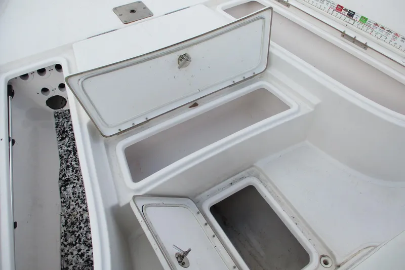 Slide: The Image of 2019 Blue Wave 2200 SL BAY boat storage compartments with open hatches. - 11
