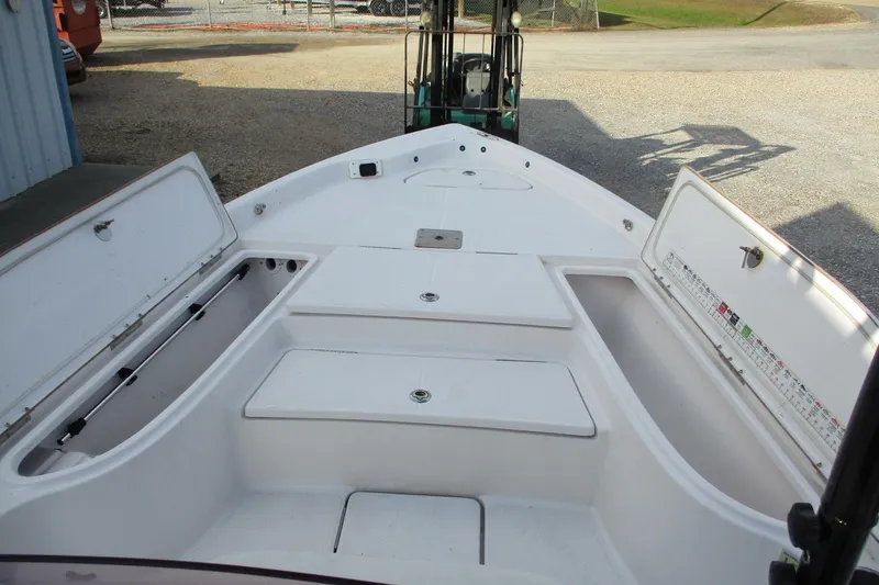 Slide: The Image of 2019 Blue Wave 2200 SL BAY boat interior with open storage compartments. - 14