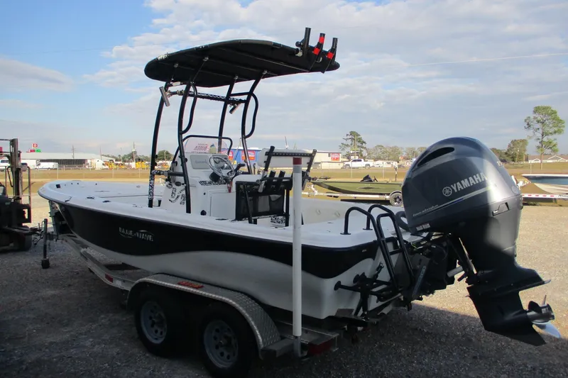 Slide: The Image of 2019 Blue Wave 2200 SL BAY boat with Yamaha outboard motor on trailer. - 3