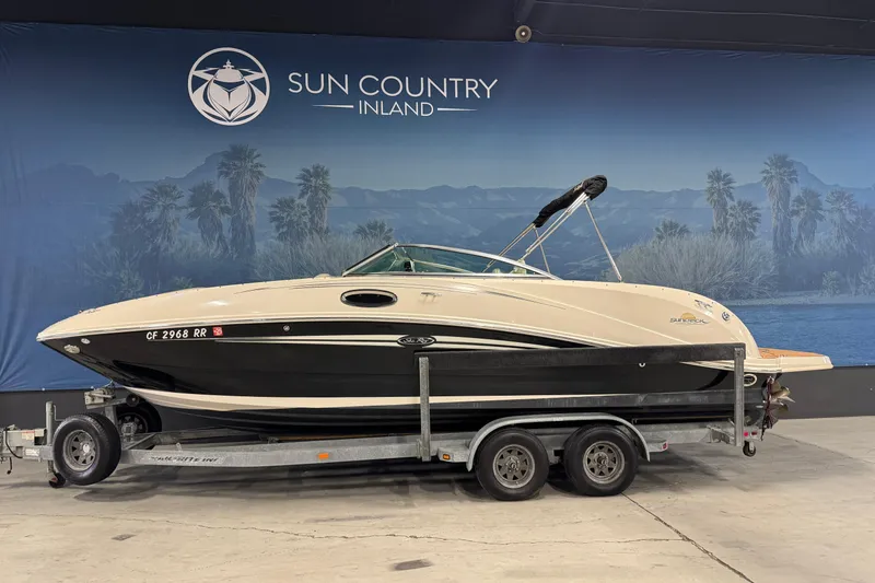 The Image of 2007 Sea Ray 260 Sundeck boat on trailer at Sun Country Inland showroom. - 1