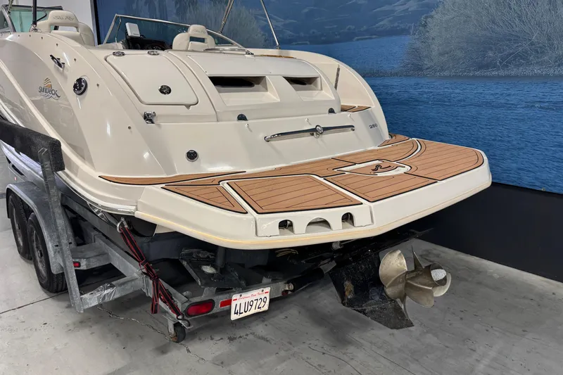 Slide: The Image of 2007 Sea Ray 260 Sundeck boat on trailer, rear view with swim platform. - 4