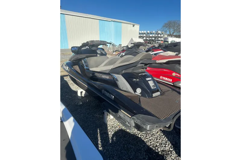 Slide: The Image of 2014 Yamaha WaveRunner FX Cruiser SVHO jet ski parked outdoors. - 6