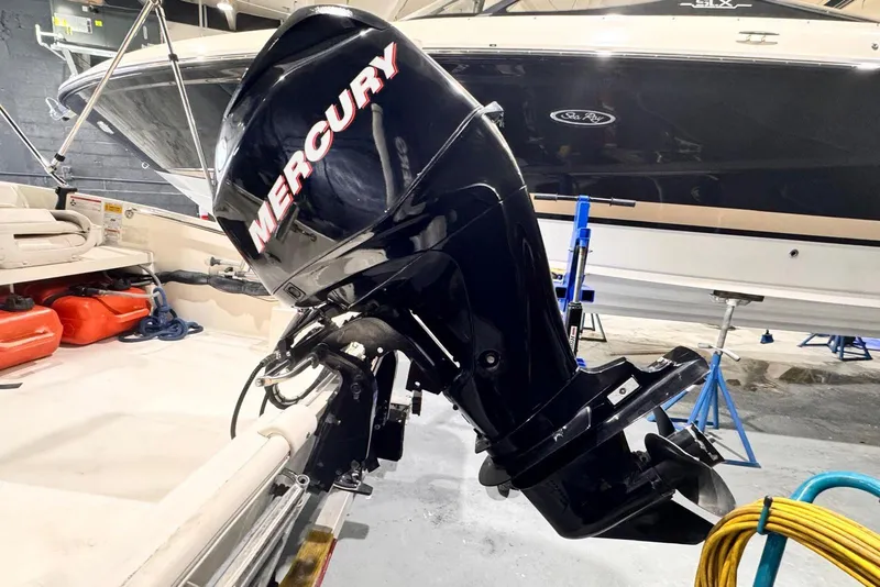 Slide: The Image of 2011 Boston Whaler 160 Super Sport with Mercury outboard engine in a boatyard. - 10
