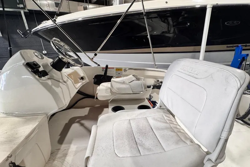 Slide: The Image of 2011 Boston Whaler 160 Super Sport interior with steering wheel and seating. - 5
