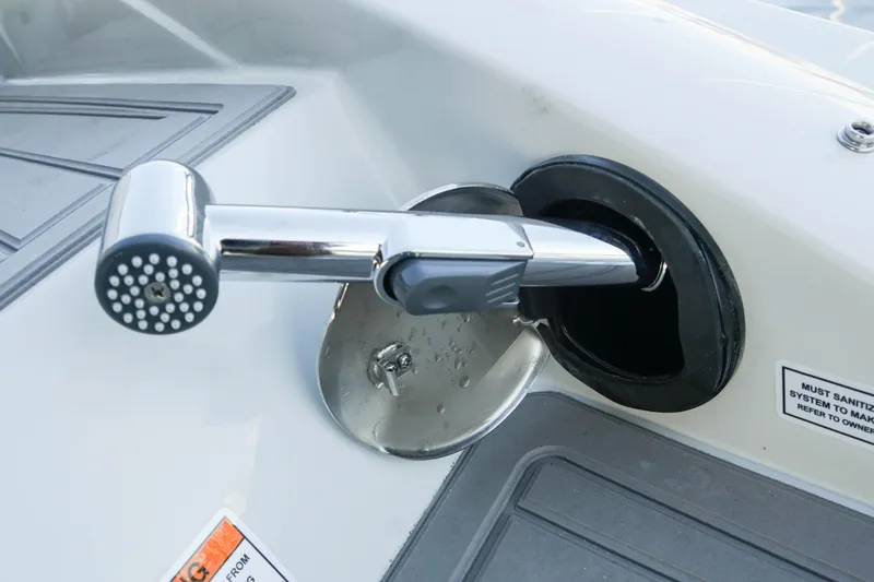 Slide: The Image of 2026 Crownline 288 SS boat shower head detail on deck. - 11