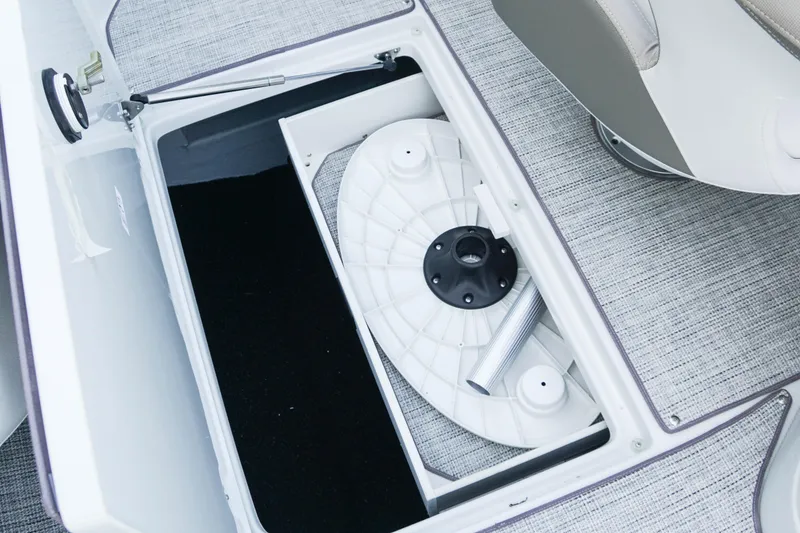 Slide: The Image of Open storage compartment in 2026 Crownline 288 SS boat, showcasing interior details. - 17