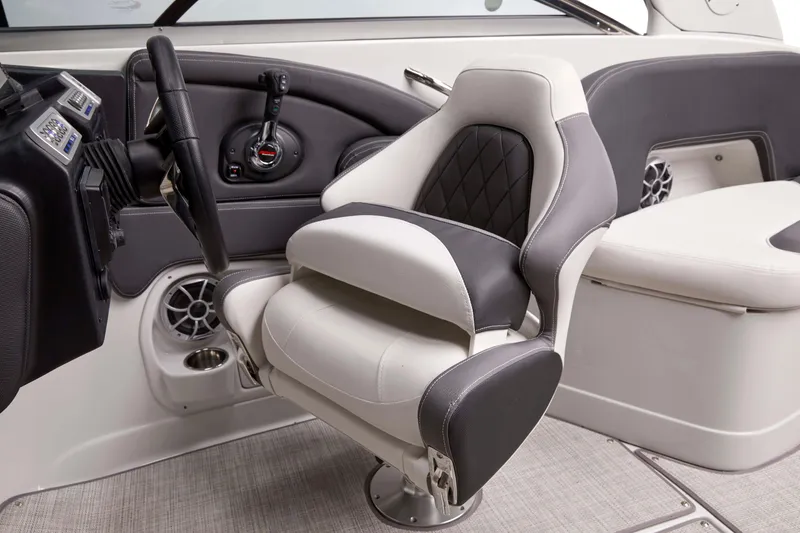 Slide: The Image of Captain's seat in 2026 Crownline 288 SS boat, featuring modern design and controls. - 4