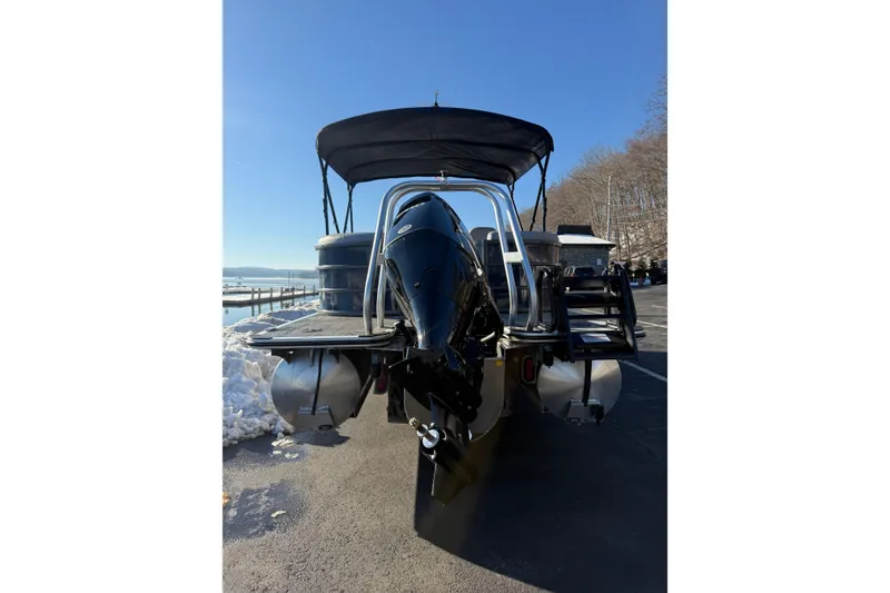 Slide: The Image of 2026 Bentley Pontoons Legacy 243 Navigator on a sunny day by the water. - 2