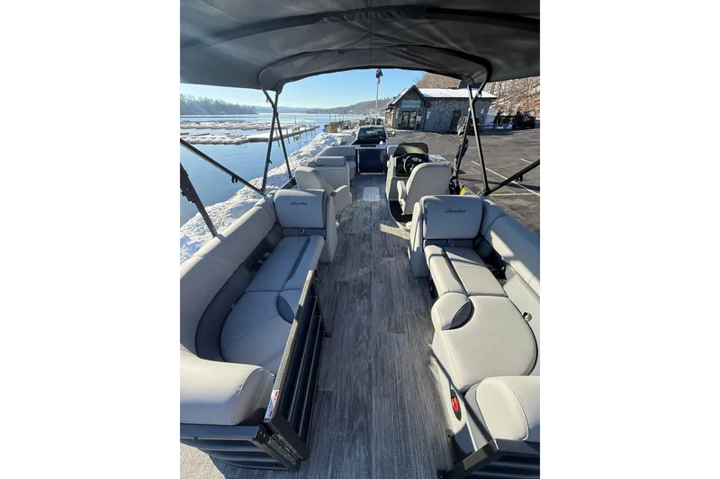 Slide: The Image of 2026 Bentley Pontoons Legacy 243 Navigator interior with spacious seating and elegant design. - 5