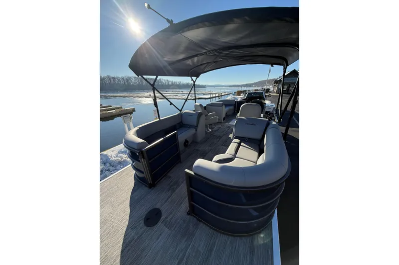 Slide: The Image of 2026 Bentley Pontoons Legacy 243 Navigator on a sunny day by the water. - 6