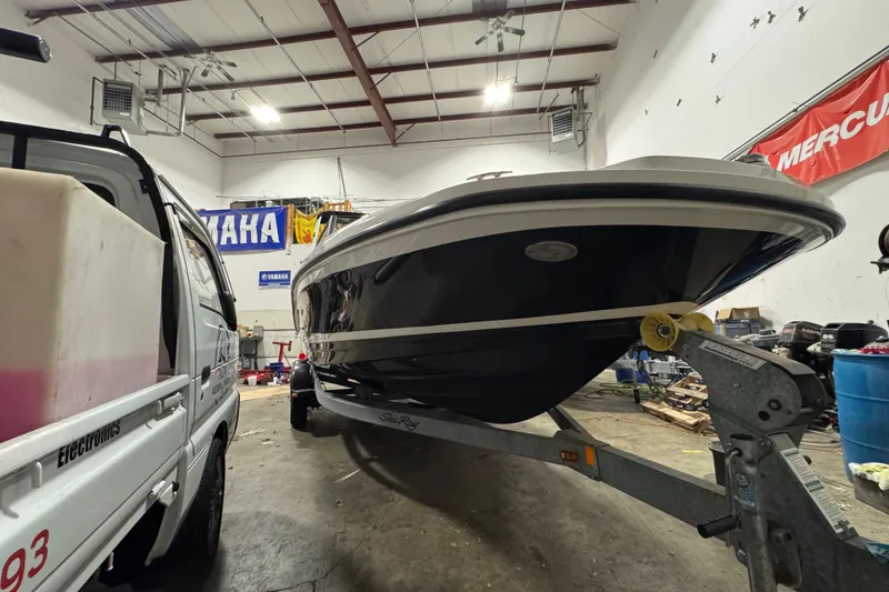 Slide: The Image of 2016 Sea Ray SPX 210 Outboard on trailer in a workshop. - 10
