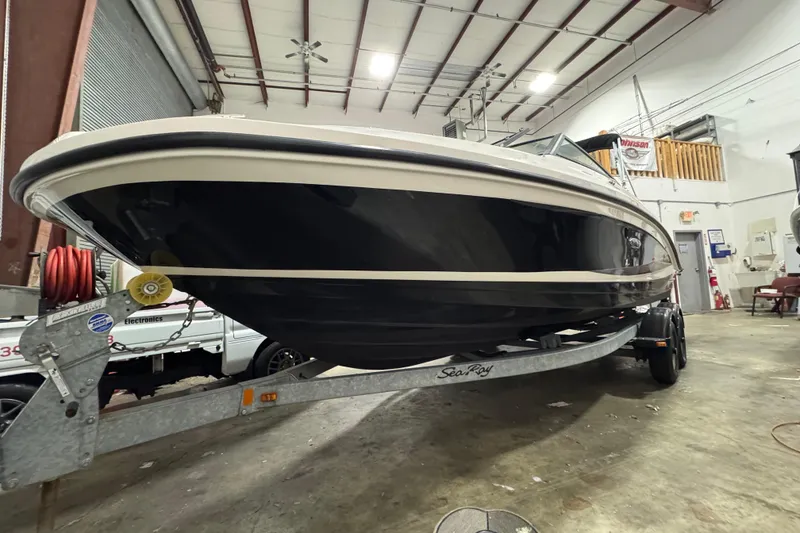 Slide: The Image of 2016 Sea Ray SPX 210 Outboard boat on trailer in indoor storage facility. - 11
