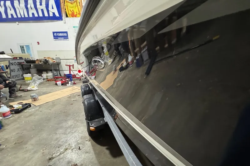 Slide: The Image of 2016 Sea Ray SPX 210 Outboard in workshop, reflecting tools and equipment. - 12