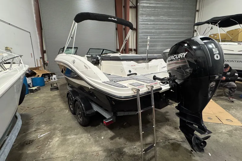 Slide: The Image of 2016 Sea Ray SPX 210 Outboard boat with Mercury 150 engine in a storage facility. - 15