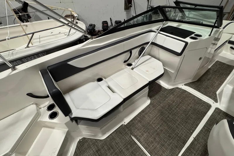 Slide: The Image of 2016 Sea Ray SPX 210 Outboard interior with seating and cup holders. - 20