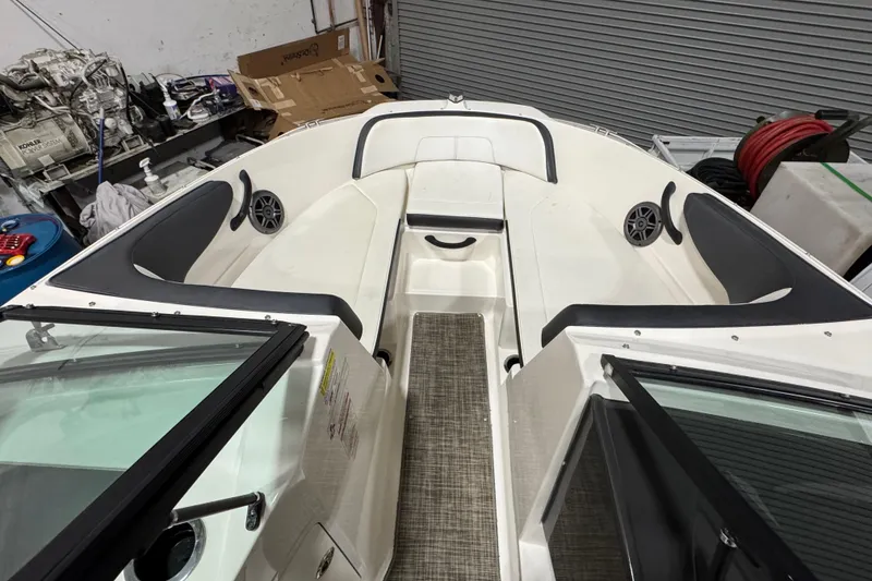Slide: The Image of 2016 Sea Ray SPX 210 Outboard boat interior with seating and speakers. - 22