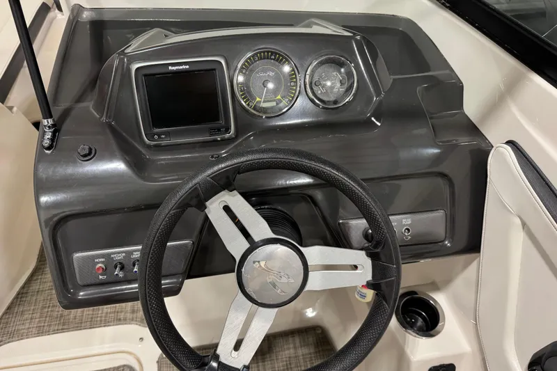 Slide: The Image of Steering console of 2016 Sea Ray SPX 210 Outboard with gauges and controls. - 23