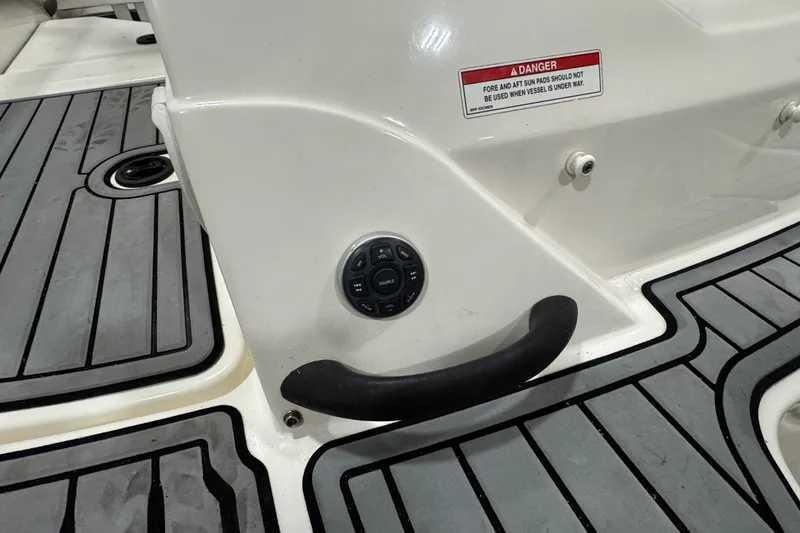Slide: The Image of 2016 Sea Ray SPX 210 Outboard boat interior with control panel and safety warning. - 26