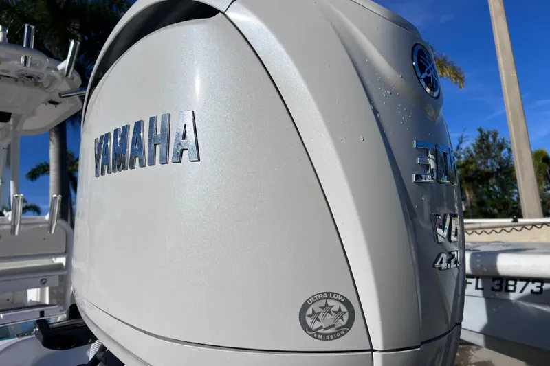 Slide: The Image of 2024 Everglades 243 Center Console with Yamaha outboard engine, ultra-low emission. - 2