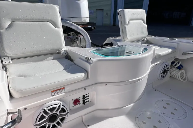 Slide: The Image of 2024 Everglades 243 Center Console boat interior with seating and audio system. - 23