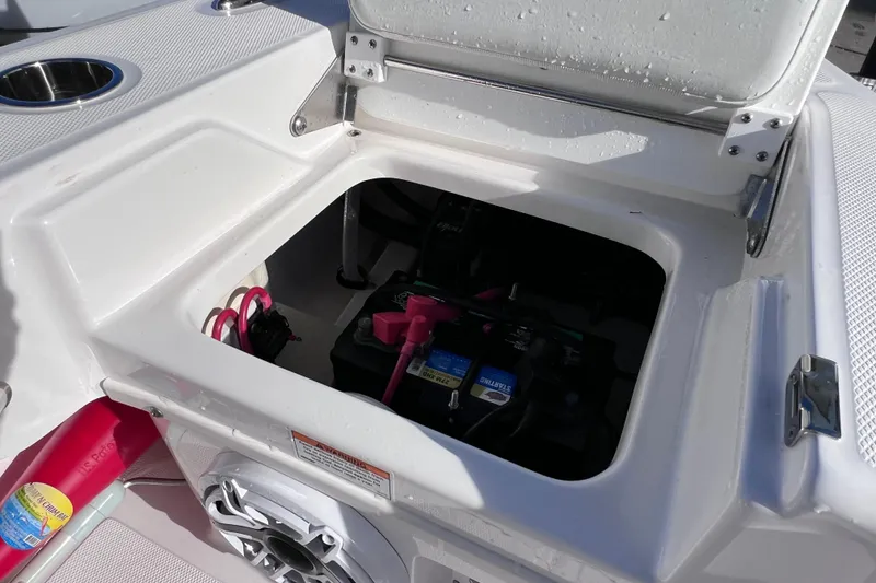 Slide: The Image of Open battery compartment on 2024 Everglades 243 Center Console boat. - 25