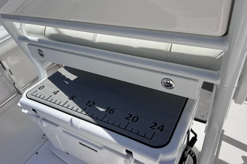 Slide: The Image of 2024 Everglades 243 Center Console boat with integrated measuring board and storage. - 34